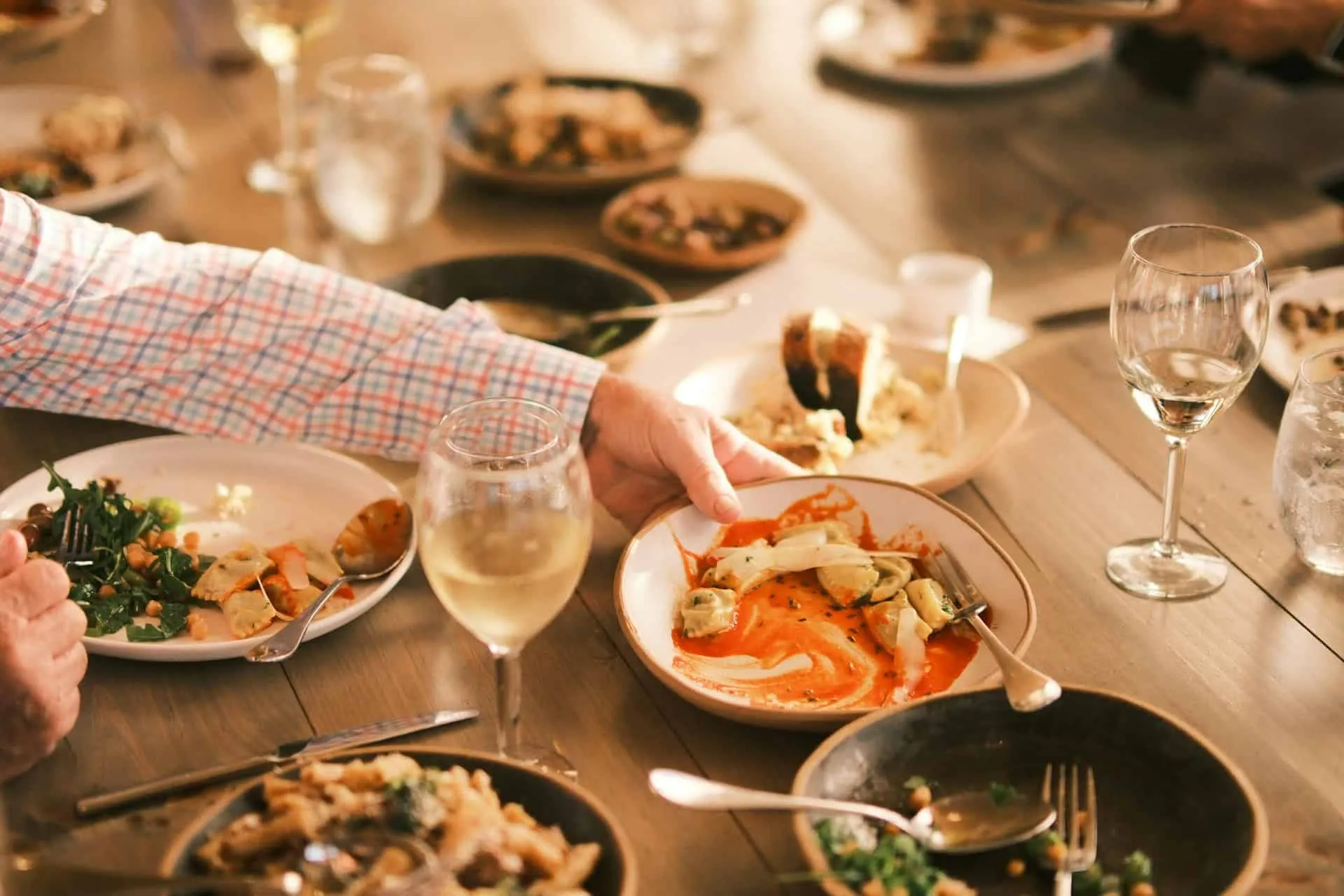 The Reunion Symphony: The Dialectics of Love & Hope in Communal Dining Traditions